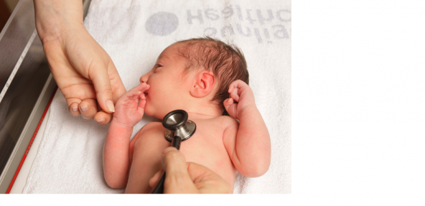 A newborn baby undergoing a physical examination.