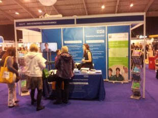 Delegates at a stand at the conference.