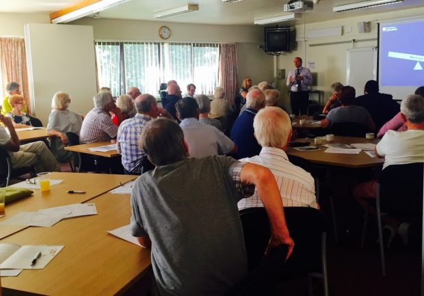 A group of people at the AAA screening service patient information session.