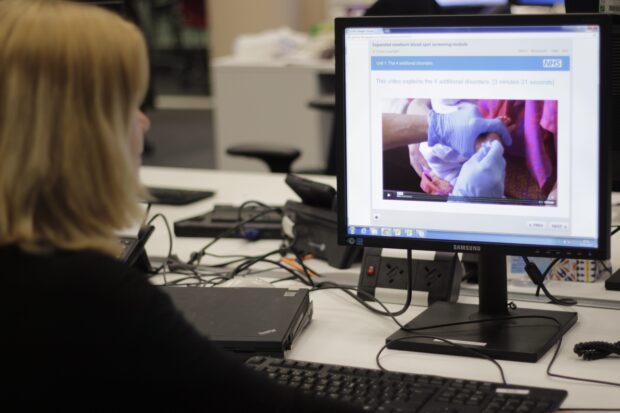 A person studying e-learning on her computer.