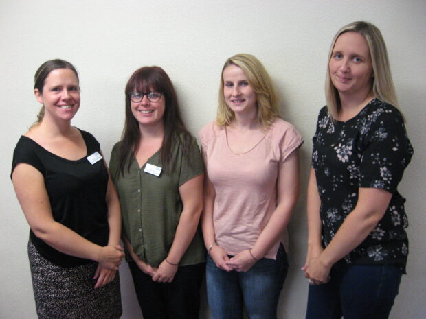 A group of newborn hearing screening staff studying for a diploma in health screening.