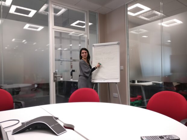 Sonia Segalini is stood at a whiteboard during her presentation