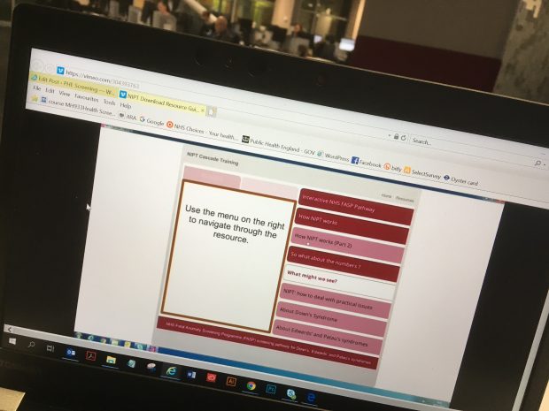 The photo shows the NIPT training resource displayed on a laptop.