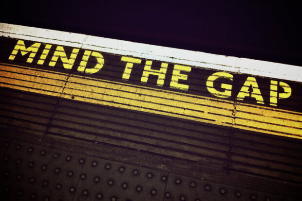 Image of 'MIND THE GAP' wording on London Underground station platform