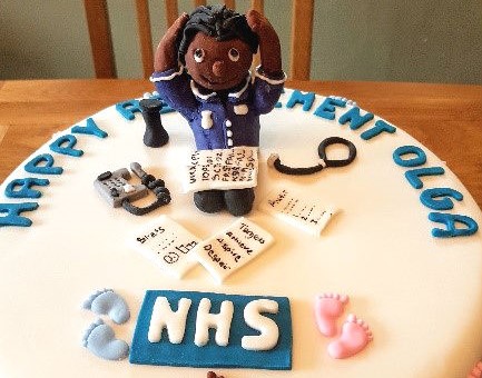 Olga Ferguson's retirement cake has the NHS logo on it and the words 'happy retirement Olga'!