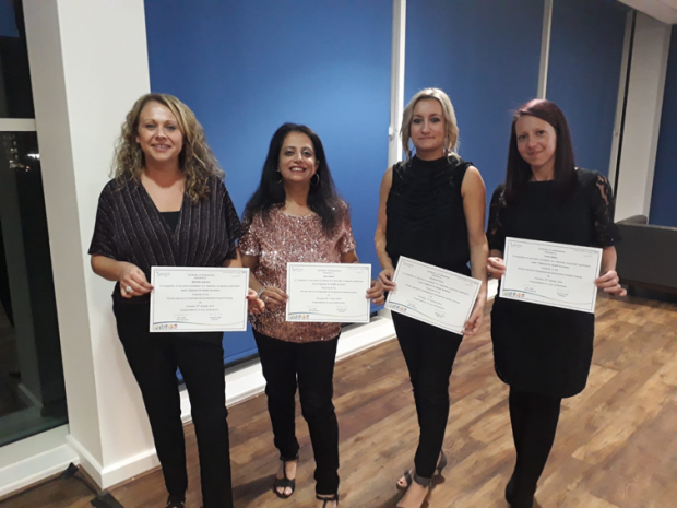 Michelle Johnson, Alpa Adatia, Izzy Petrie and Sarah Bailey are shown lined up holding certificates for completing the Level 3 Diploma in Newborn Hearing Screening.