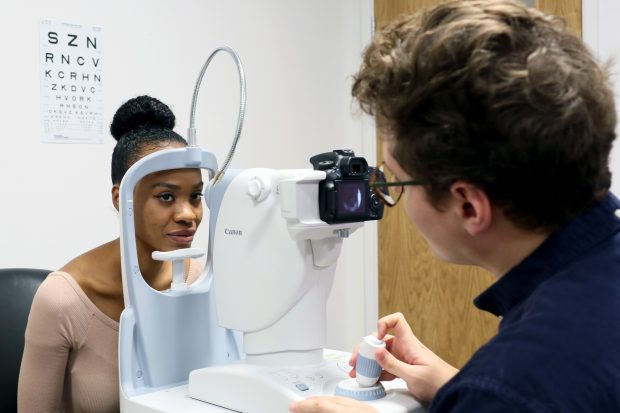 A woman having an eye test taken.