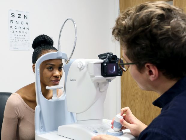 A woman having an eye test taken.