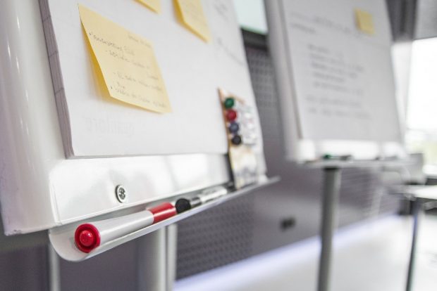 Two whiteboards with marker pens